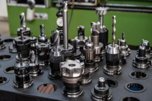A table with cnc mill tools in tool holders.